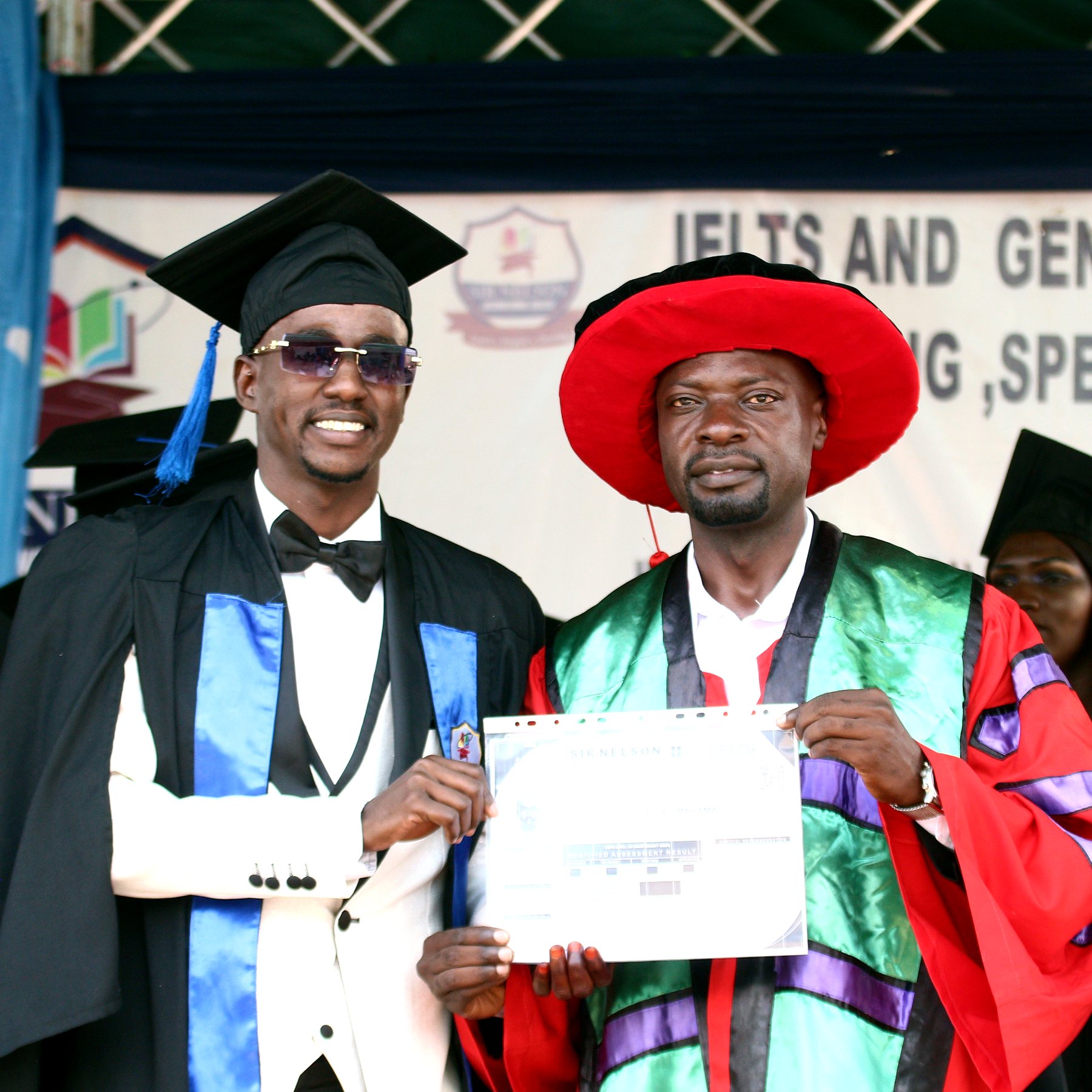 Sir Nelson graduate receiving a certificate during a graduation event