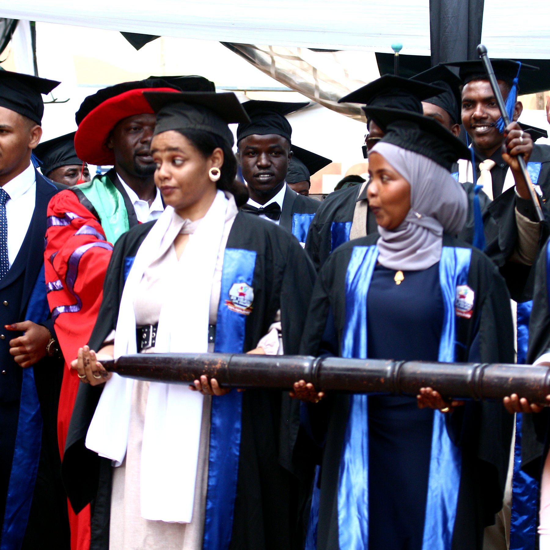 Sir Nelson graduates standing together during a ceremony