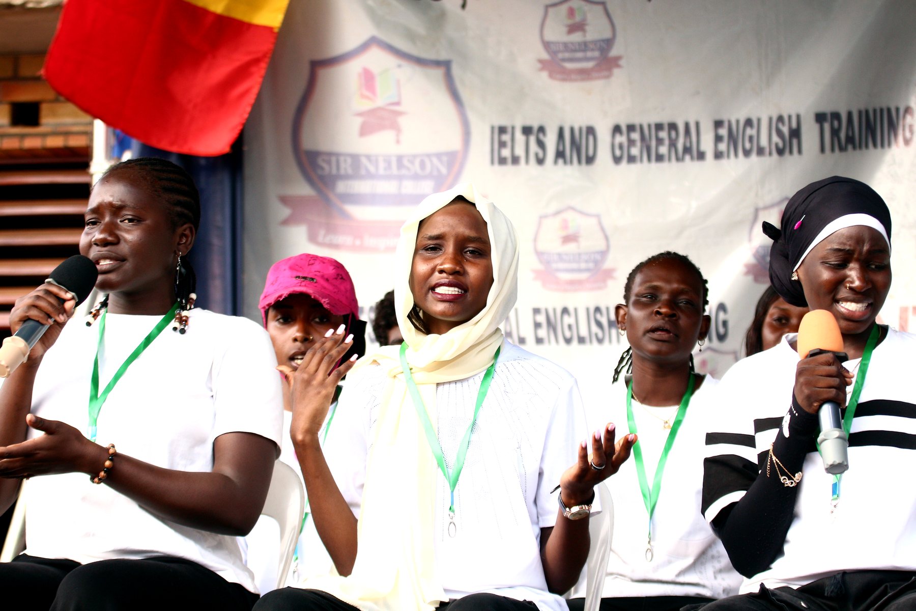Sir Nelson students speaking together during a school event